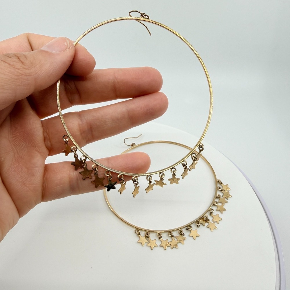 Gold Tone Large Hoop Earrings with Celestial Star Dangle Charms